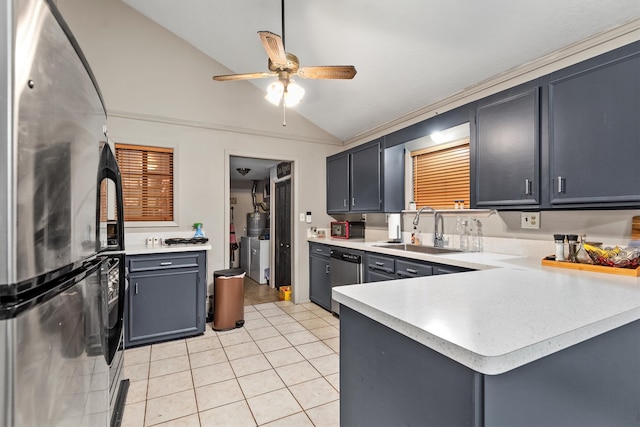 kitchen with sink, stainless steel appliances, kitchen peninsula, lofted ceiling, and light tile patterned flooring