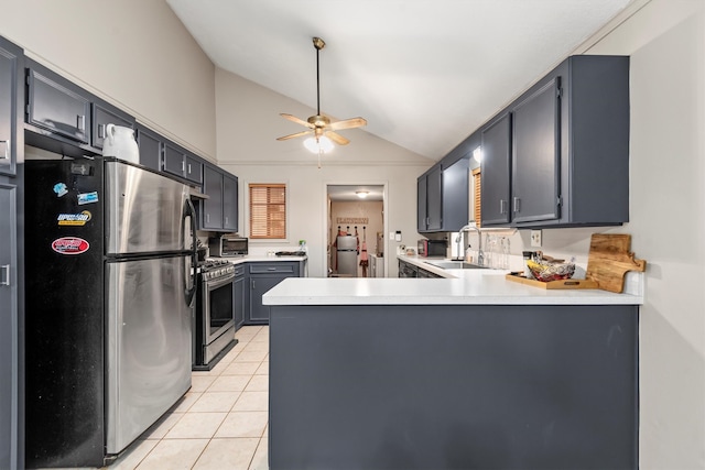 kitchen with sink, ceiling fan, light tile patterned floors, appliances with stainless steel finishes, and kitchen peninsula