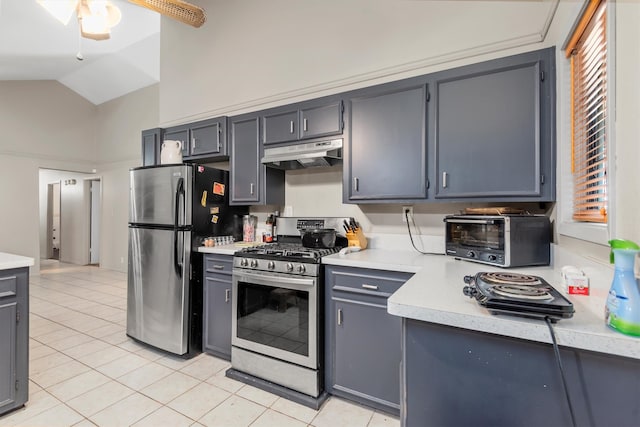 kitchen with gray cabinetry, ceiling fan, light tile patterned floors, and appliances with stainless steel finishes