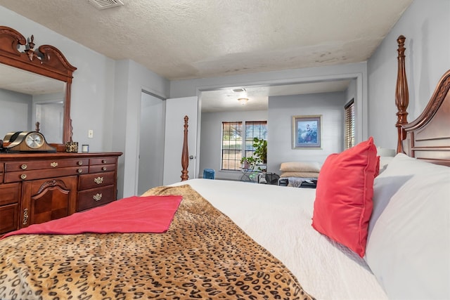 bedroom featuring a textured ceiling