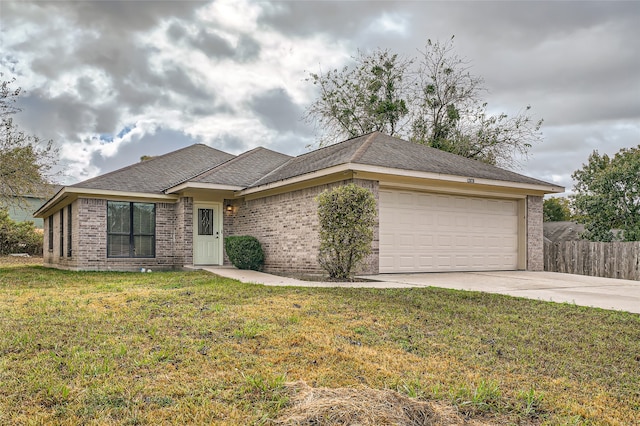 view of front of home featuring a front lawn and a garage