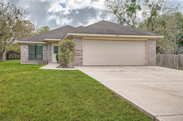 single story home with brick siding, an attached garage, and a front lawn