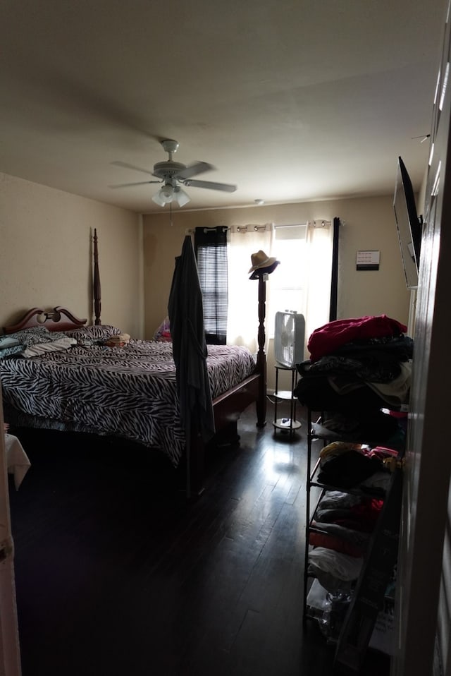 bedroom with hardwood / wood-style floors and ceiling fan