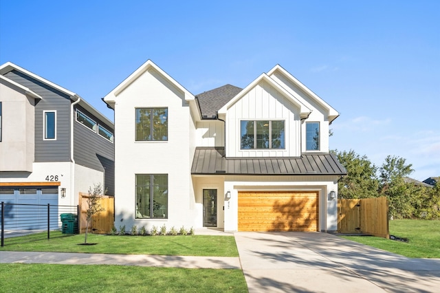 modern inspired farmhouse featuring a garage and a front yard