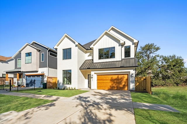 view of front of house featuring a front yard and a garage