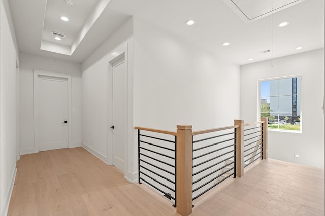 corridor with light hardwood / wood-style flooring