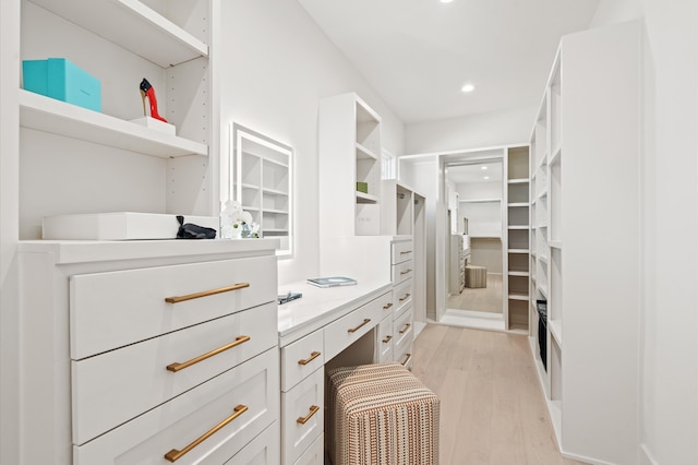 spacious closet featuring light hardwood / wood-style floors