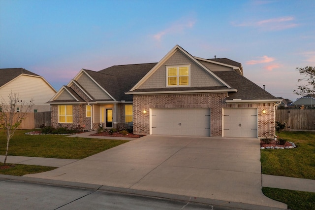 craftsman-style home with a yard and a garage