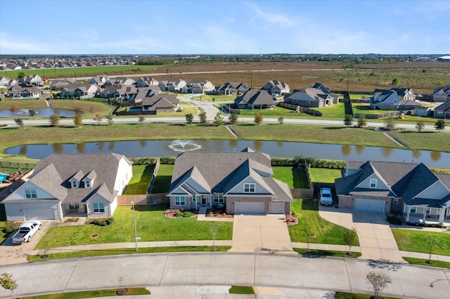 drone / aerial view featuring a water view