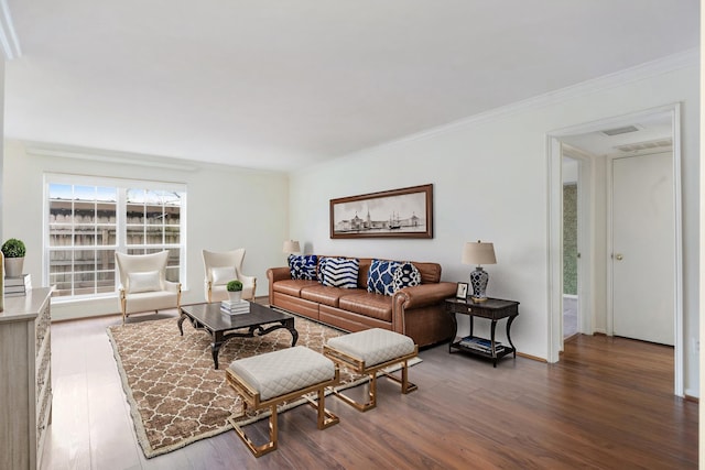 living room featuring dark hardwood / wood-style floors and crown molding