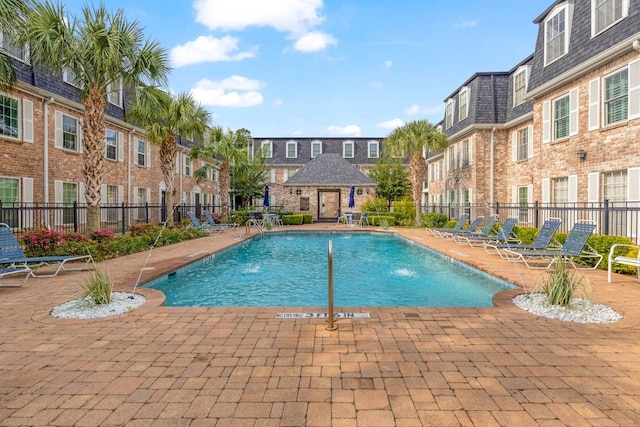 view of pool featuring a patio area and pool water feature