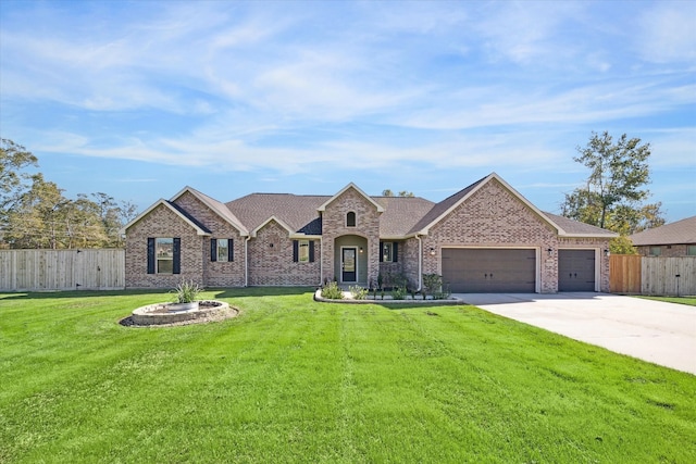 view of front of house with a garage and a front lawn