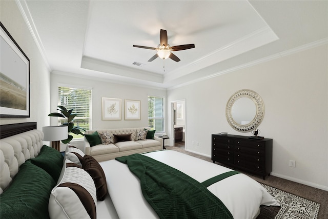 bedroom featuring a raised ceiling, ornamental molding, carpet flooring, and ceiling fan