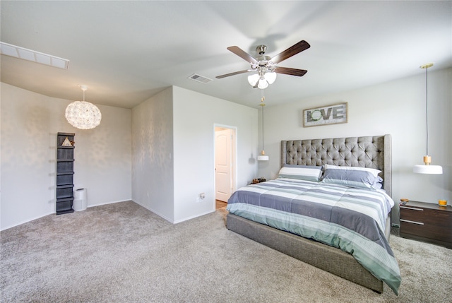 bedroom with ceiling fan and light colored carpet