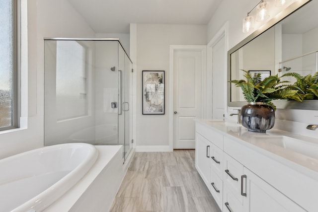 bathroom with vanity and independent shower and bath