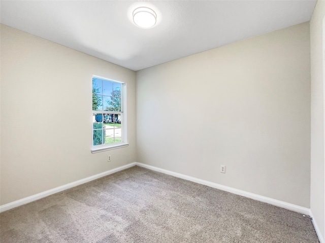 unfurnished room featuring carpet