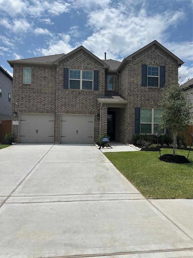 1253 Woodflower Dr, Katy, TX 77493 - traditional home with brick siding, a garage, driveway, and a front yard