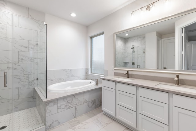 bathroom with vanity and separate shower and tub