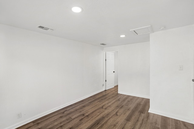 empty room featuring dark wood-type flooring