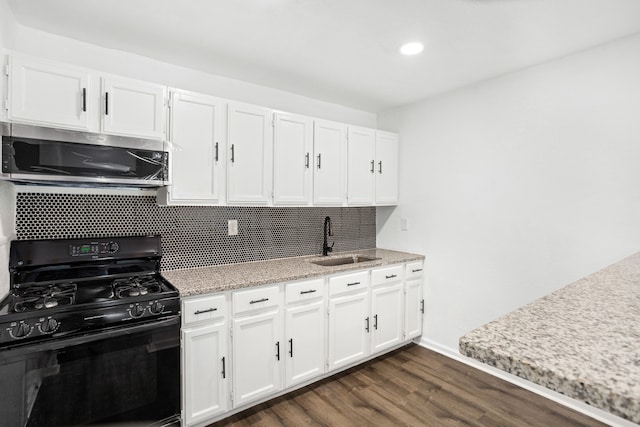 kitchen featuring backsplash, white cabinets, black range with gas stovetop, sink, and dark hardwood / wood-style flooring