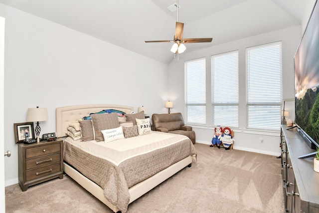 bedroom with light carpet, vaulted ceiling, and ceiling fan