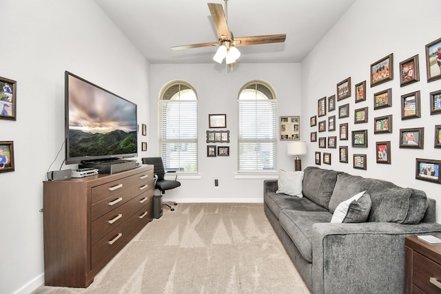 living room featuring light colored carpet and ceiling fan