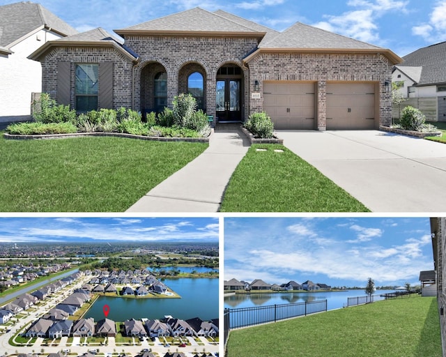 view of front of home with a water view, a garage, and a front yard