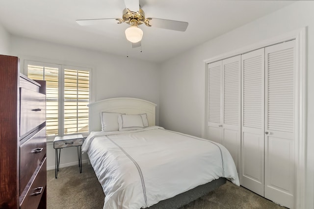 bedroom with dark colored carpet, a closet, and ceiling fan