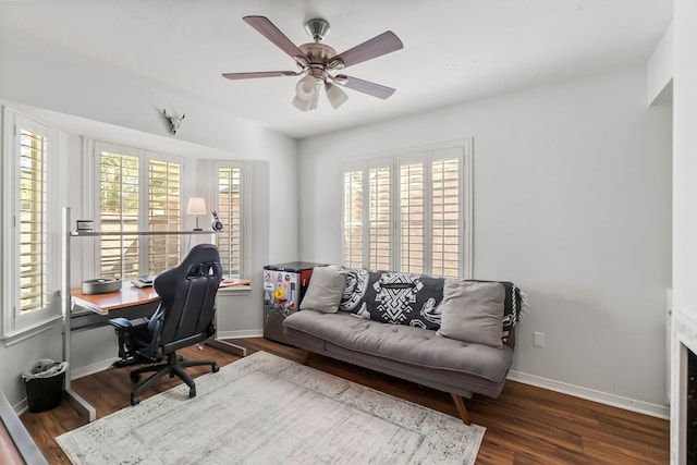 office with ceiling fan, dark hardwood / wood-style flooring, and a healthy amount of sunlight