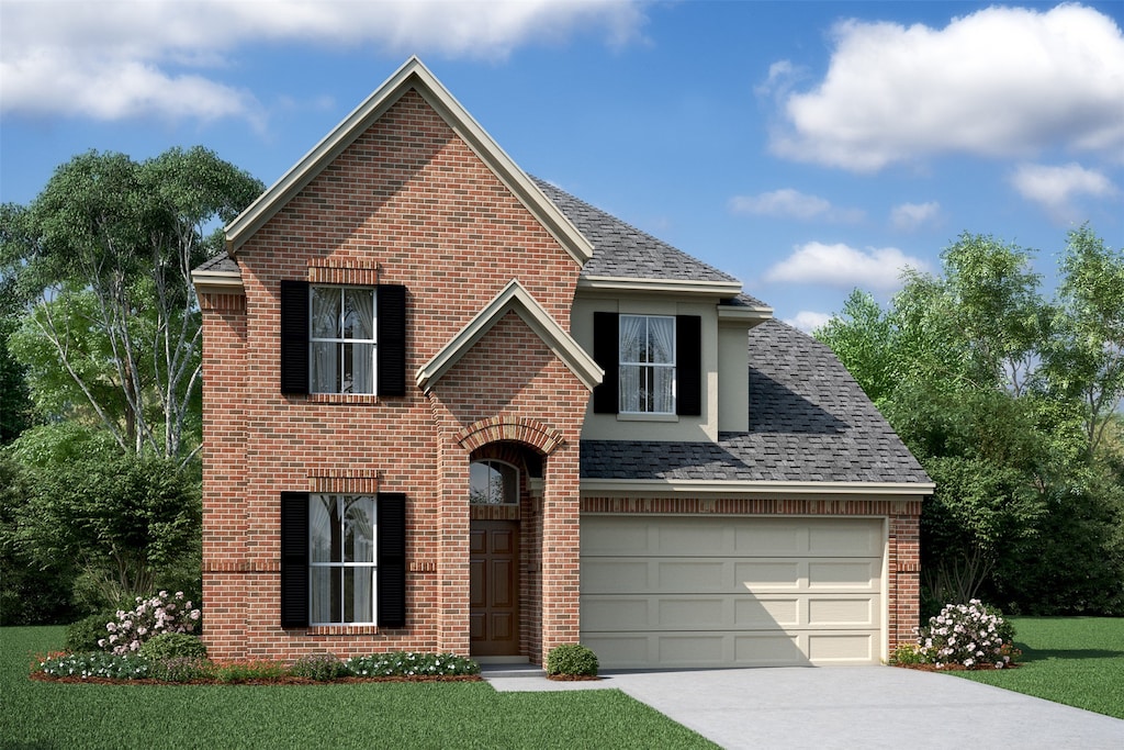 view of front of house with a garage and a front lawn