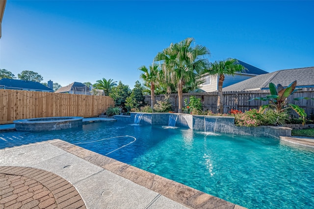 view of pool with an in ground hot tub and pool water feature