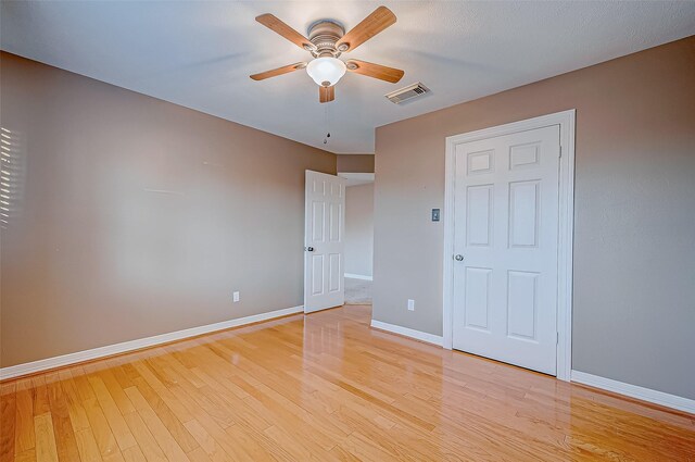 unfurnished bedroom featuring light hardwood / wood-style floors and ceiling fan