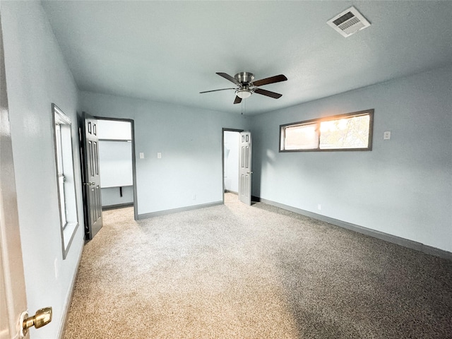 unfurnished bedroom with ceiling fan and light carpet