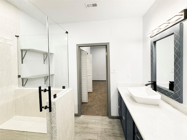 bathroom featuring vanity and walk in shower