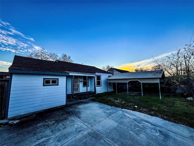 view of front of property featuring a carport