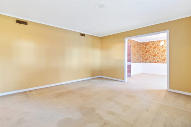 empty room with carpet flooring and ornamental molding