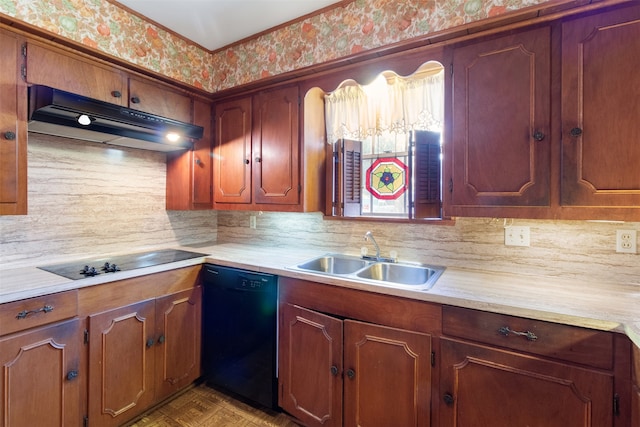 kitchen featuring black appliances, sink, and tasteful backsplash