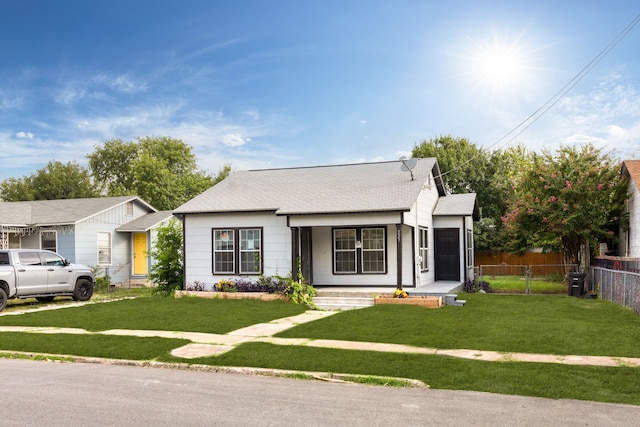 view of front of house featuring a front yard and a porch