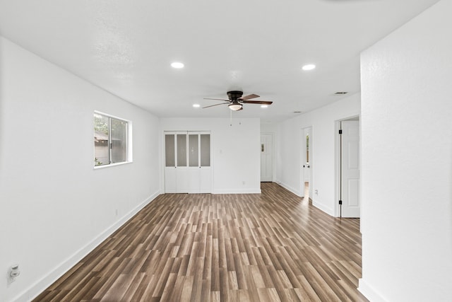 spare room featuring ceiling fan and hardwood / wood-style floors