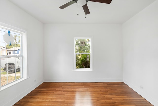 unfurnished room with light wood-type flooring and ceiling fan