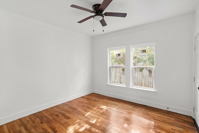 unfurnished room with light hardwood / wood-style flooring, ceiling fan, and crown molding