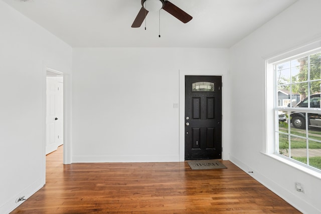 foyer entrance with hardwood / wood-style floors and ceiling fan