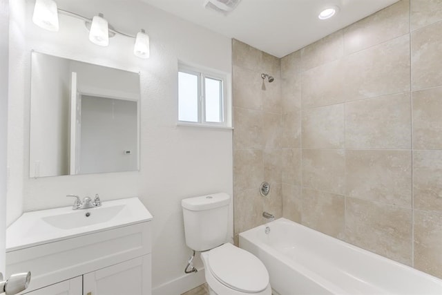 full bath with visible vents, shower / washtub combination, vanity, and toilet