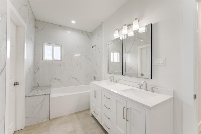 full bath with double vanity, a tub, a marble finish shower, and a sink