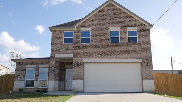 traditional-style home featuring driveway, a garage, stone siding, fence, and brick siding