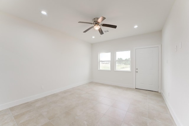 spare room with baseboards, visible vents, and recessed lighting