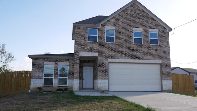 view of front of property featuring fence, concrete driveway, and brick siding