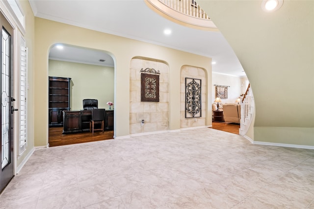 foyer entrance featuring ornamental molding