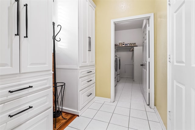 interior space featuring tile patterned floors and washer and clothes dryer