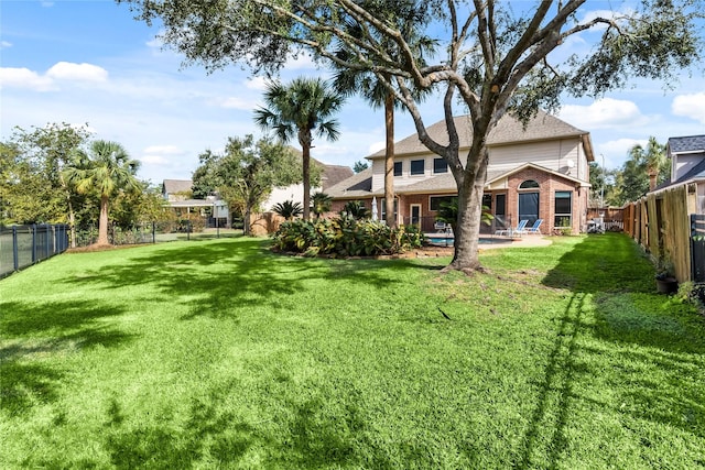 view of yard with a fenced backyard